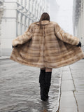 Back view of wide-swinging blond pastel mink fur coat stroller jacket, emphasizing its luxurious volume and vintage charm.