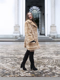 Full-body view of blond pastel mink fur coat stroller jacket, ideal for showcasing elegant winter fashion and sustainable fur.