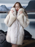 Woman wearing a fur coat with a blurred background