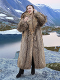 Real Finnish Raccoon Fur Coat in natural hues, featuring thick fur texture and elegant shawl collar, modeled in snowy mountain terrain.