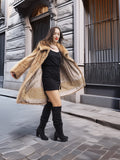Golden Reverie M - Open mink coat twirling to showcase golden lining and elegant movement in luxury fashion.