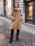 Golden Reverie M - Full-length blond mink coat with gold buttons, styled with black boots for timeless outerwear appeal.