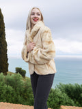 Reversible Versatile Sheared Mink Fur Jacket Coat S in creamy mink fur, worn in a relaxed pose with ocean and greenery in background.