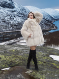 Soft Plush Blush Fox Jacket S/M styled on mountain top, showcasing plush fox fur and elegant silhouette in a snowy setting.
