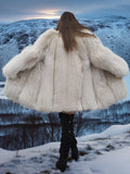 Back view of Soft Plush Blush Fox Jacket S/M with fully let out fox pelts, highlighting volume and texture against a winter backdrop.