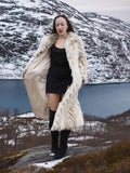 Two Tone Fox Coat Size XS/S worn open over a black dress, highlighting the coat’s soft interior and luxurious chevron fur design.