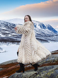 Model twirling in Two Tone Fox Coat Size XS/S, showcasing the coat’s flowing chevron fur and full-length luxury design.