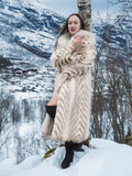 Two Tone Fox Coat with chevron pattern and oversized collar, styled in a snowy forest setting for luxurious winter outerwear appeal.