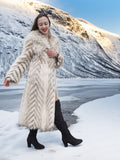 Two Tone Fox Coat Size XS/S styled in a snowy landscape, highlighting the coat’s chevron fur pattern and elegant silhouette.