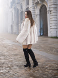 Brown Cross Mink Fur Coat Jacket S with Blush Fox Trim styled with black knee-high boots on cobblestone street. Elegant outerwear for winter fashion.