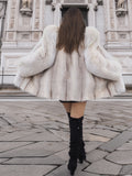 Back view of Brown Cross Mink Fur Coat Jacket S with Blush Fox Trim showing voluminous silhouette and soft natural fur, perfect for elegant streetwear.