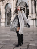 Model twirls in Sapphire Grey Mink Fur Coat S Petit Excellent, showcasing its flowing silhouette and luxurious fur finish.