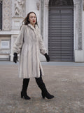 Elegant winter fashion with Sapphire Grey Mink Fur Coat S Petit Excellent, styled with black suede boots and gloves in a historic plaza.