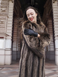 Close-up of Canadian Raccoon Fur Coat with silver tips, highlighting plush fur texture and scalloped sleeve design for winter fashion.