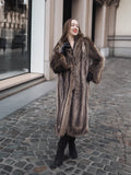 Canadian Raccoon Fur Coat in silver tips styled with black winter boots, ideal for elegant and warm fur fashion looks.