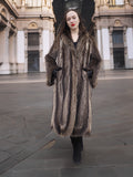 Front view of Canadian Raccoon Fur Coat in silver tips, full-length design with scalloped hem for luxury winter outerwear.