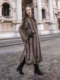 Side profile of Canadian Raccoon Fur Coat in silver tips, highlighting natural fur texture and elegant winter fashion silhouette.