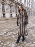 Walking in Canadian Raccoon Fur Coat with silver tips, full-length natural fur outerwear ideal for elegant winter style.
