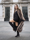 Canadian Raccoon Fur Coat in silver tips styled with black mini dress and thigh-high boots, blending luxury with modern fashion.
