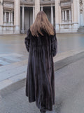 Back view of NAFA black mink fur coat, showcasing its luxurious length and flowing silhouette.