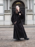 NAFA black mink fur coat with a classic silhouette, styled elegantly in a historic city setting.