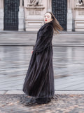 NAFA dark ranch mink fur coat styled with black boots, creating a sophisticated and timeless winter fashion statement.