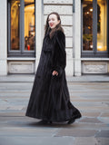 Luxurious NAFA black mink fur coat with a flowing silhouette, styled for an elegant and refined winter look.