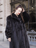 Close-up of NAFA black mink fur coat highlighting its rich texture, wing collar, and elegant craftsmanship.