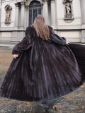 Full-length NAFA dark ranch black mink fur coat with a voluminous sweep, showcasing its rich texture and elegant drape.