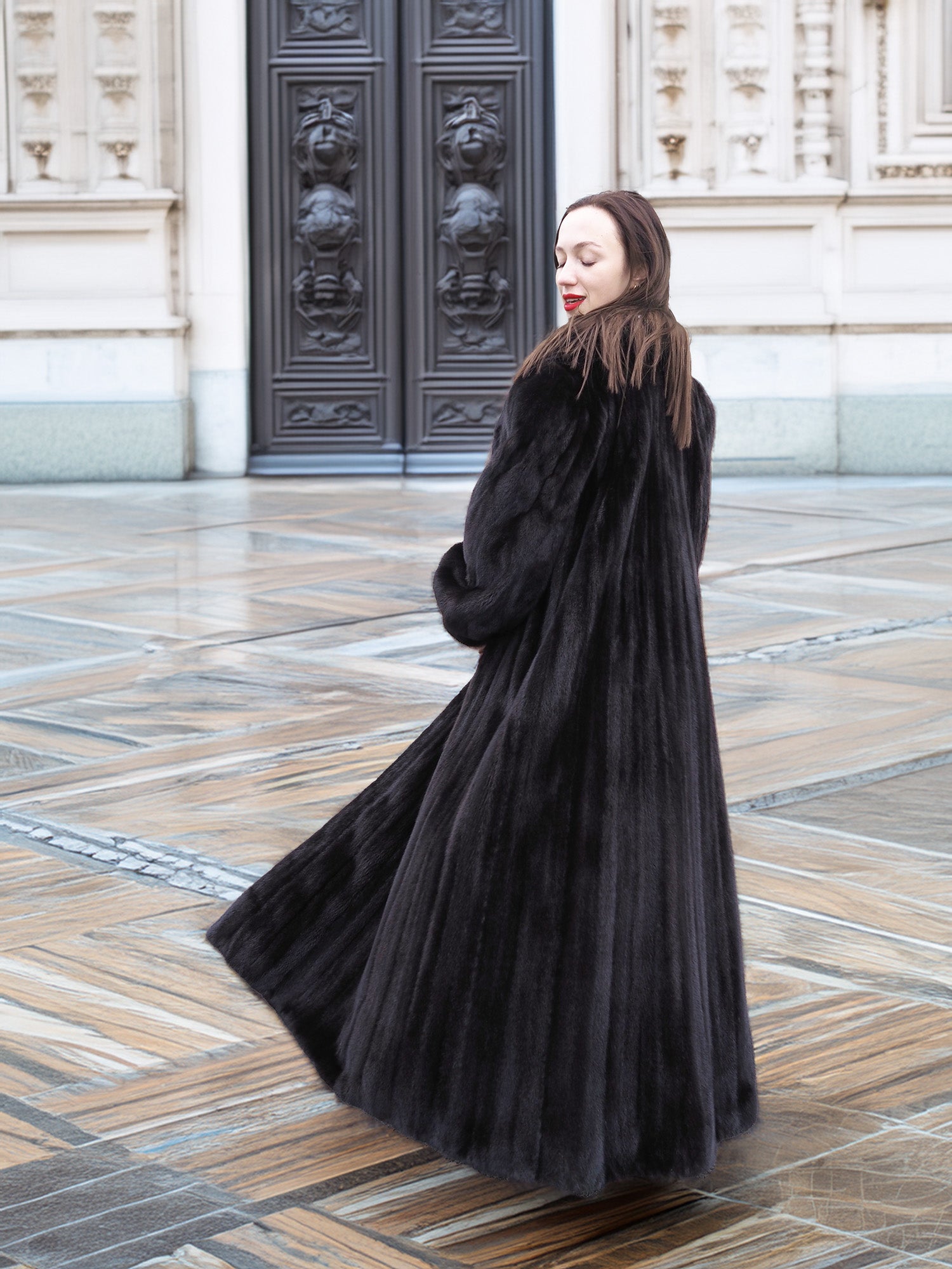 Full-length NAFA black mink fur coat with a voluminous sweep, highlighting its plush texture and timeless elegance.