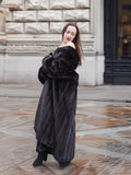 Elegant NAFA mink fur coat draped off the shoulders, styled for a sophisticated and glamorous winter outfit.