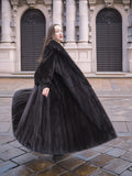 NAFA dark ranch mink fur coat with a dramatic sweep, styled for a glamorous winter fashion statement.