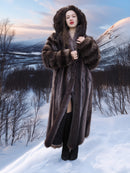 Hooded Canadian Raccoon Fur Coat - Silver Tips M worn in snowy mountain setting. Luxurious winter coat with natural fur.