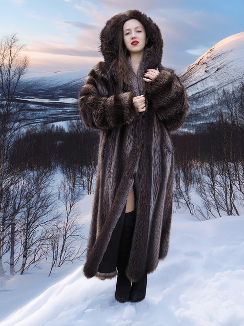 Hooded Canadian Raccoon Fur Coat - Silver Tips M worn in snowy mountain setting. Luxurious winter coat with natural fur.