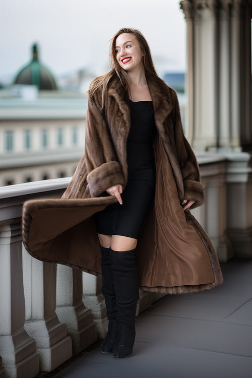 Mink coat with wide cuffs, dark brown fur; open drape over forearms