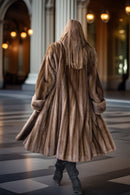 Brown mink coat from behind, flared swing hem and thick fur cuffs