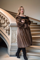 Mink coat front view, dark brown fur with shawl collar; arms crossed