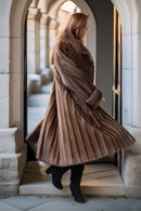 Demi-buff mink swing coat with full flared skirt and wide collar, back view