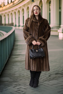 Fine mink coat with hood and swing hem, textured fur sleeves and warm brown tone