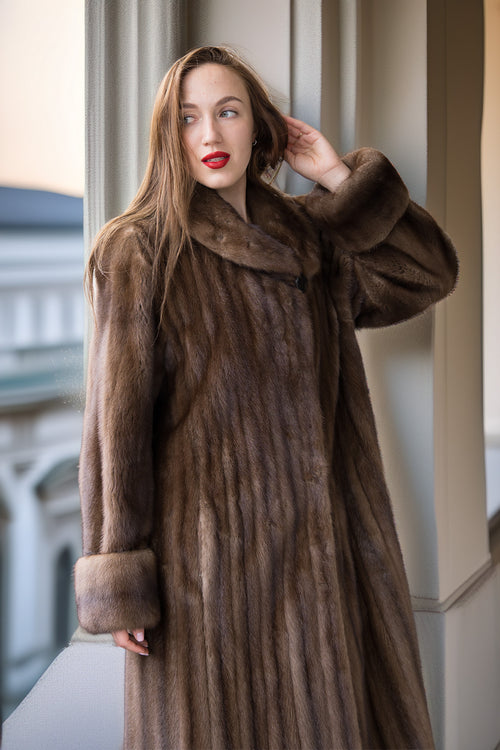Brown mink coat close-up: textured fur, wide shawl collar, cuff detail