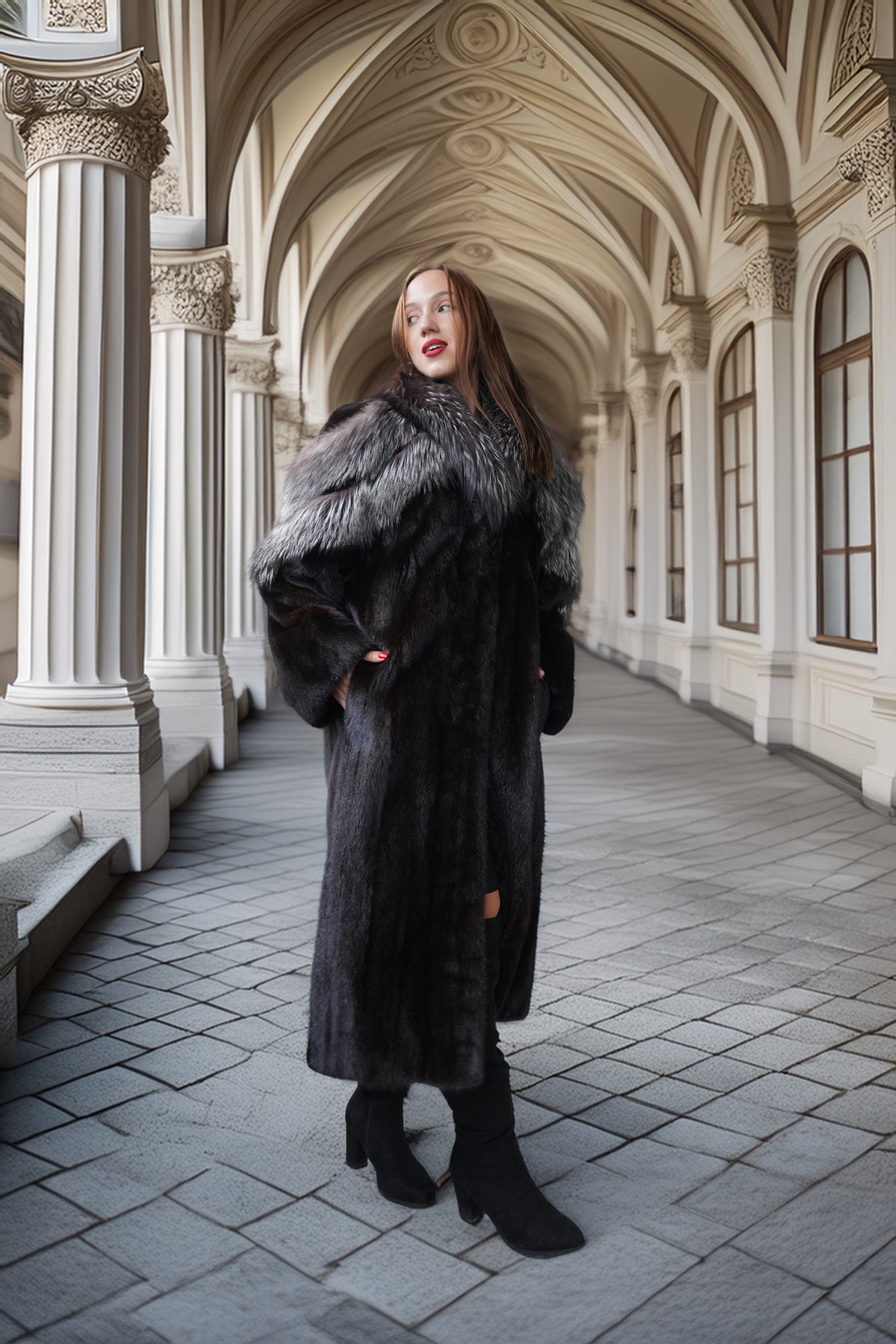 A woman wearing a long black fur coat with a gray and white fur collar, standing in a grand arched corridor with stone columns and tiled floors.