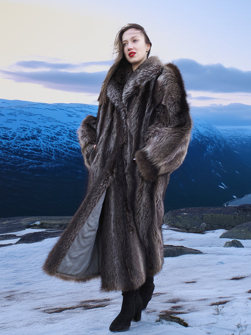 High End Canadian Raccoon Fur Coat with voluminous sleeves, displayed in snowy mountain landscape, ideal for elegant winter fashion.