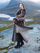 Elegant Canadian Raccoon Fur Coat S/M 48" long, flowing design showcased in scenic mountain setting, premium real fur winter fashion.