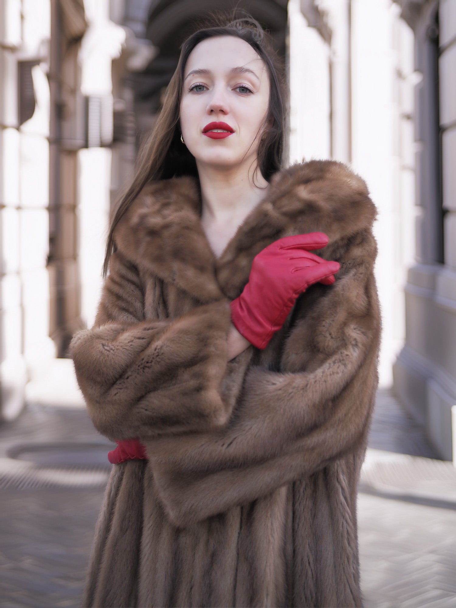 Model wearing vintage pastel Canadian brown mink fur coat with red gloves, showcasing plush collar and premium mink fur detail.