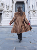 Back view of vintage pastel Canadian brown mink fur coat in motion, emphasizing flowing fur design and premium outerwear quality.