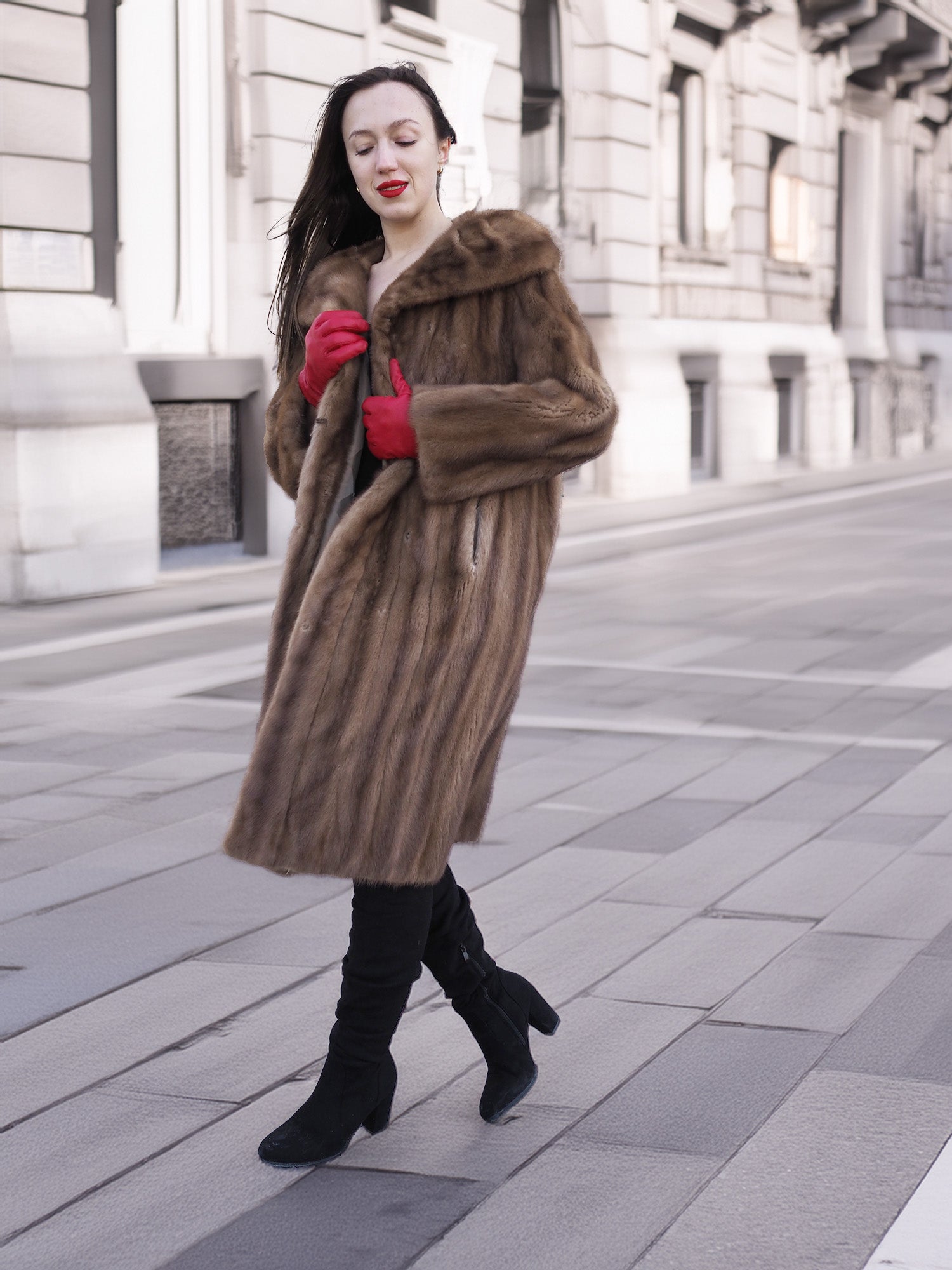 Model walking in vintage pastel Canadian brown mink fur coat, styled with red gloves and boots for refined winter outerwear fashion.
