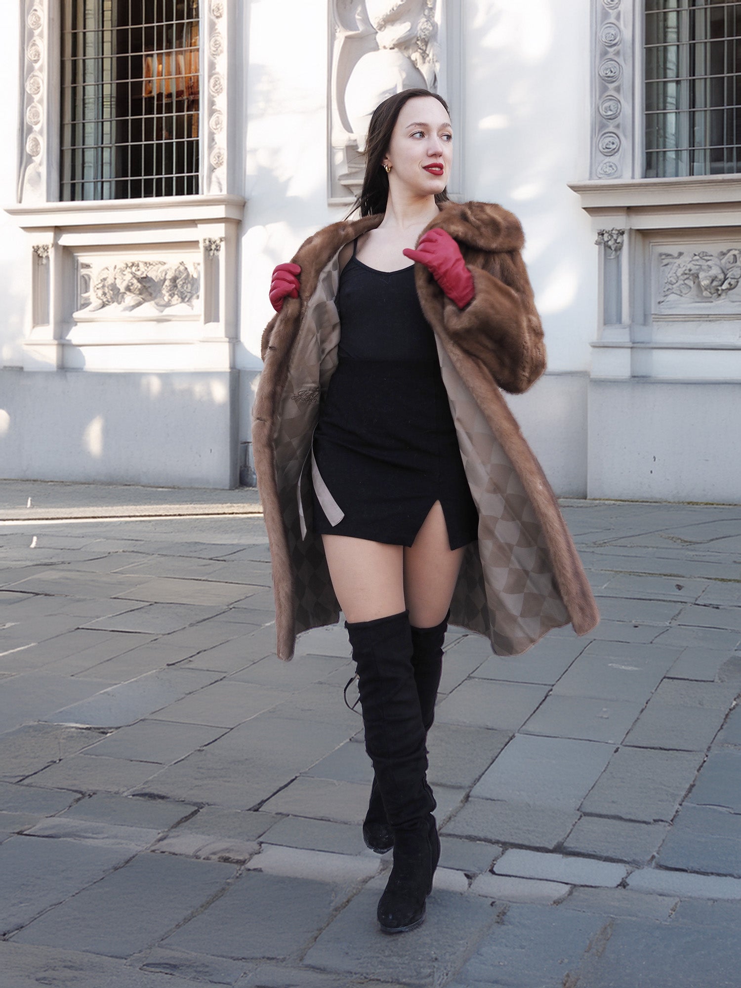 Model in motion wearing vintage pastel Canadian brown mink fur coat over black dress, ideal for bold and elegant winter fashion.