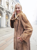 Close-up of classic pastel brown mink fur coat stroller jacket M/L showing texture and collar. High-quality mink coat for winter wear.