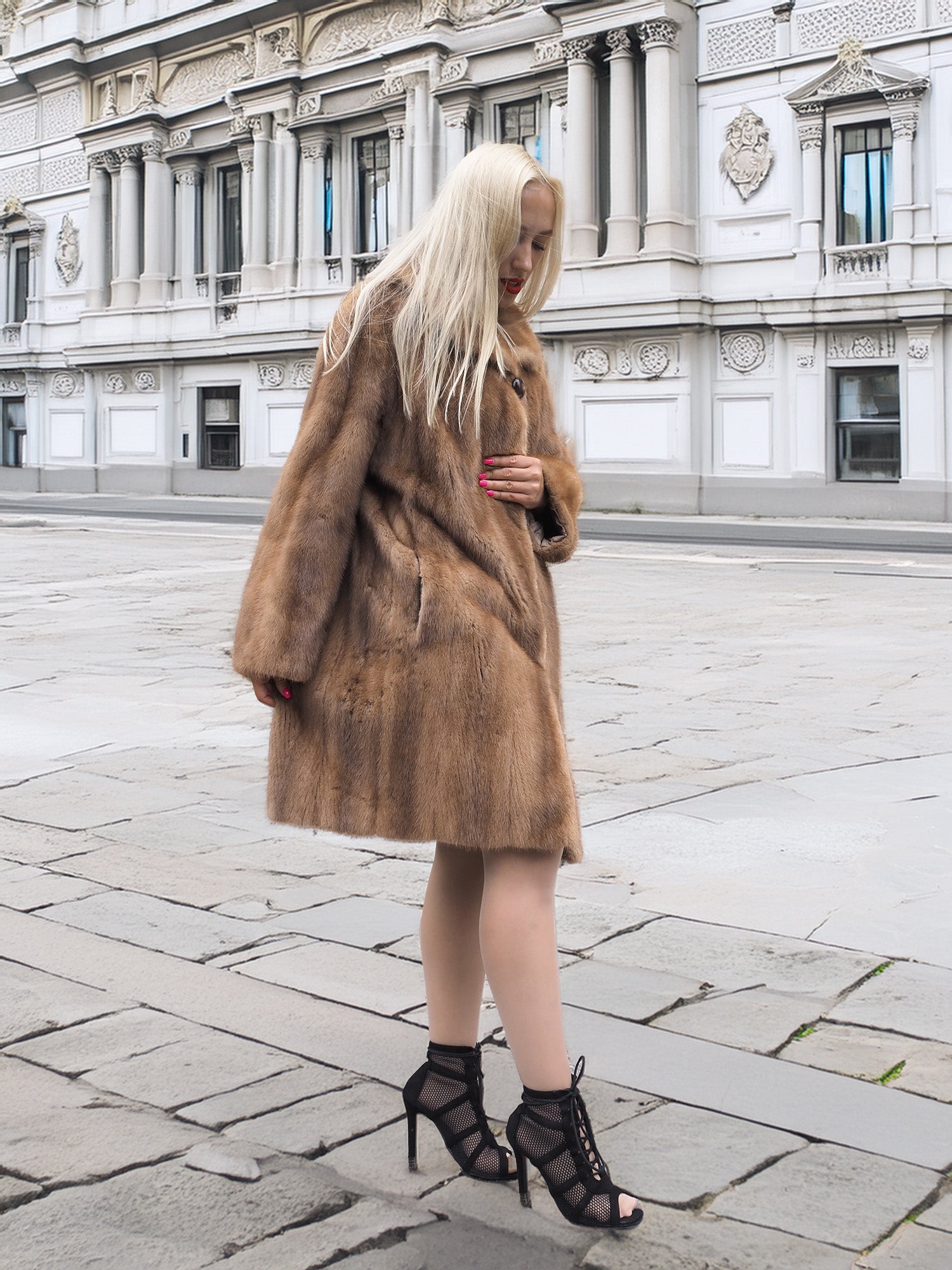 Classic pastel brown mink fur coat stroller jacket M/L styled with heels in front of ornate building. Pre-owned luxury fur outerwear.
