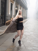 Woman twirls in classic pastel brown mink fur coat stroller jacket M/L, revealing silky lining. Elegant pre-owned mink coat for women.